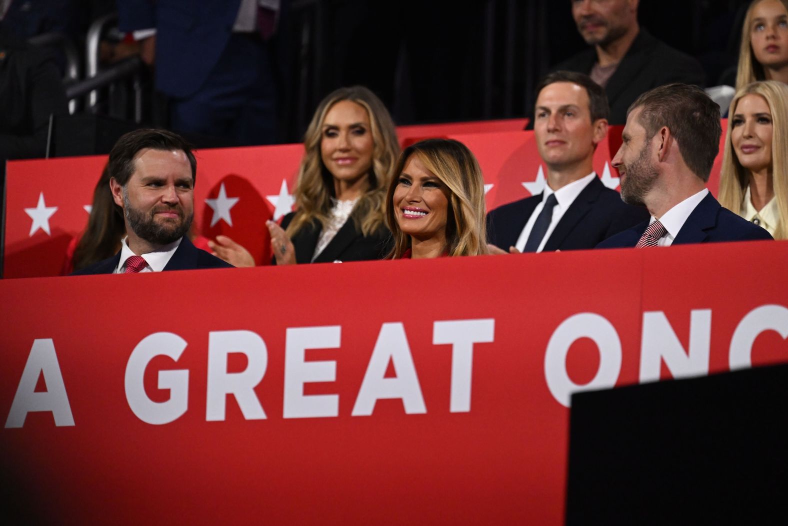 The former first lady sits next to Vance, left, and Eric Trump in the VIP box.