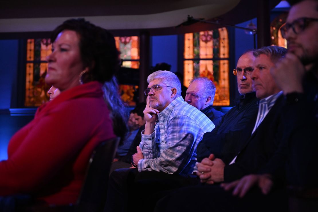 An audience member listens during the debate as Haley and DeSantis answer questions.