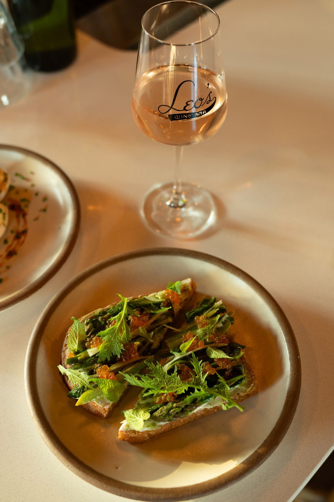 At Leo’s House of Thirst in West Asheville, wines from its impressive list pair with menu items such as this asparagus tartine.