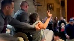woman carried lawler town hall 1.jpg