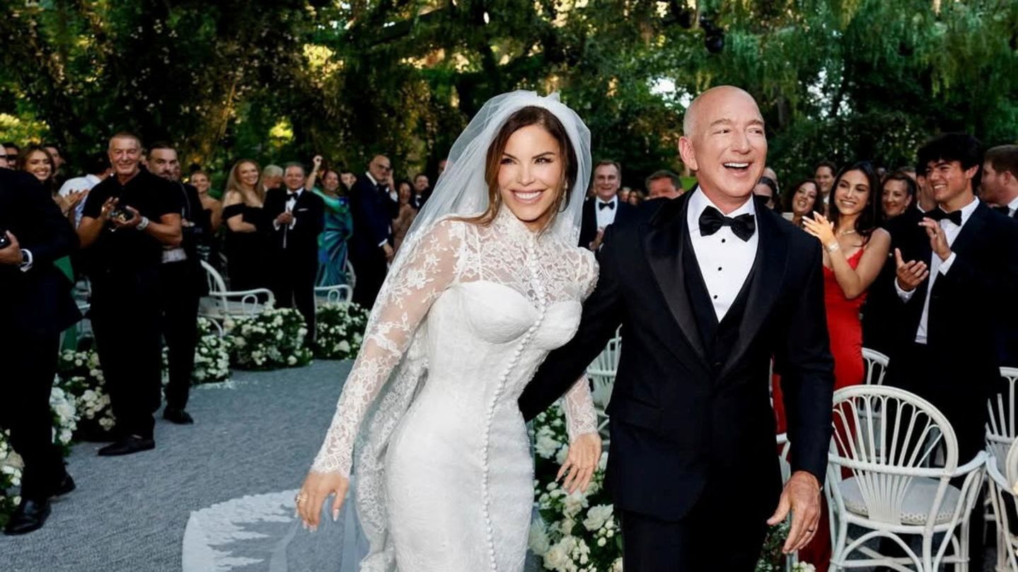 Amazon Founder Jeff Bezos and Media Personality Lauren Sanchez Bezos react on the day of their wedding in Venice, Italy, June 27, 2025 in this picture obtained from social media. @laurensanchezbezos via Instagram/via REUTERS  THIS IMAGE HAS BEEN SUPPLIED BY A THIRD PARTY. MANDATORY CREDIT. NO RESALES. NO ARCHIVES.