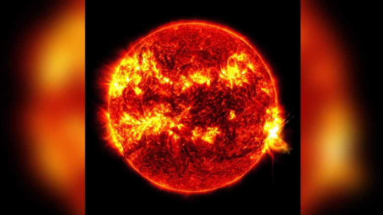 NASA’s Solar Dynamics Observatory captured this image of a solar flare – as seen in the bright flash on the right – on May 14, 2024. The image shows a subset of extreme ultraviolet light that highlights the extremely hot material in flares and which is colorized in red and yellow.