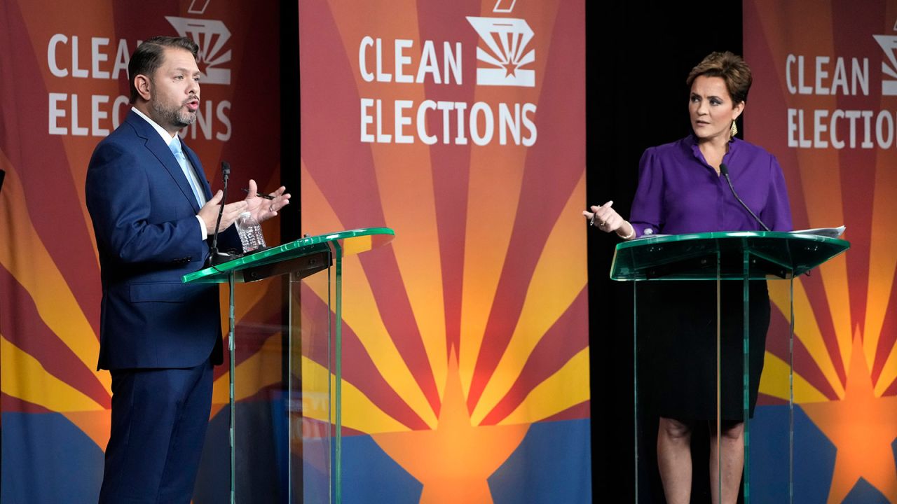 Senate candidates Rep. Ruben Gallego, left, and Kari Lake participate in a debate in Phoenix, Arizona, on October 9, 2024, .