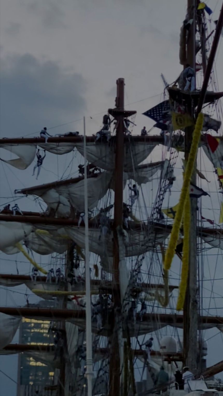 This screengrab taken from a video appears to show people hanging from the mast of the Mexican Navy training ship shortly after it struck the Brooklyn Bridge in New York, on Saturday, May 18, 2025. More than a dozen people were injured, and while no one is reported missing, two people died, according to New York City Mayor Eric Adams.