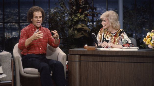 TONIGHT SHOW STARRING JOHNNY CARSON -- Air Date 09/28/1981 -- Pictured: (l-r) Fitness expert Richard Simmons, guest host Joan Rivers  (Photo by Paul Drinkwater/NBC/NBCU Photo Bank via Getty Images)