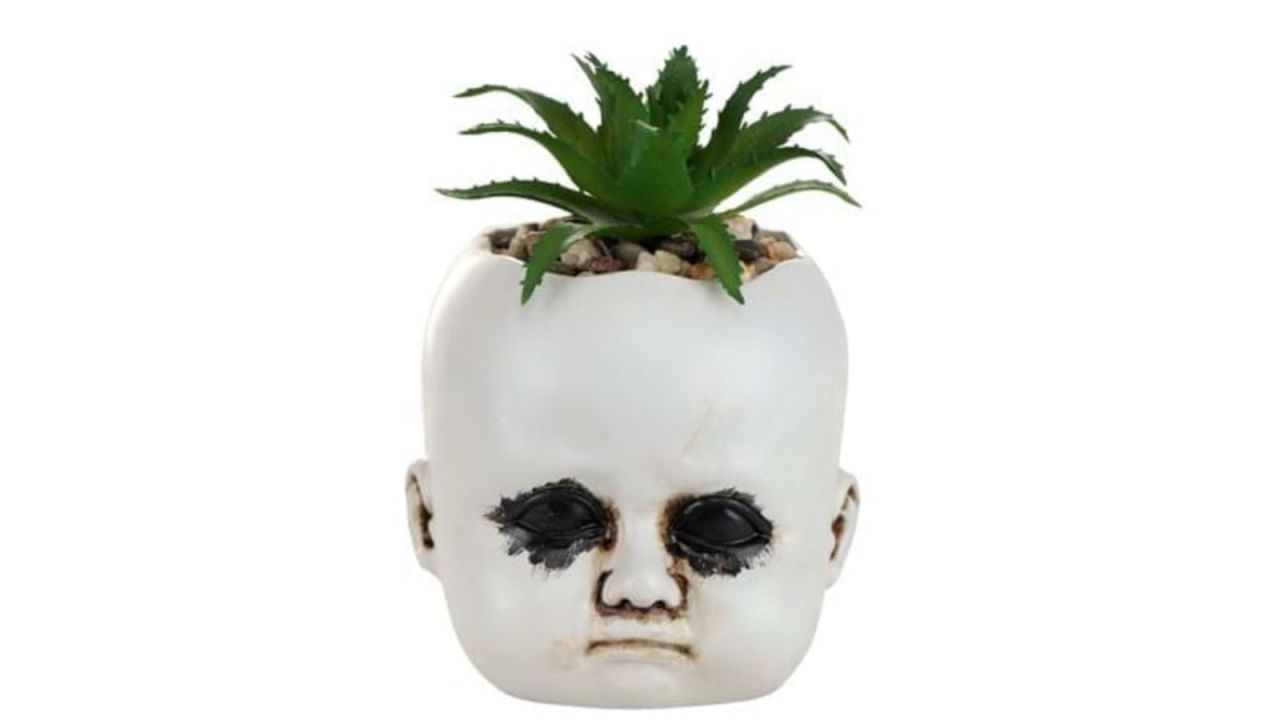 210921121918-indoor-halloween-decorations-distressed-doll-succulent-plant-holder.jpg