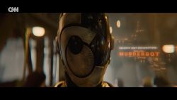 <p>Skarsgård stars in the title role as a security robot that hacks its programming, and loves soap operas. Rick Damigella reports.</p>