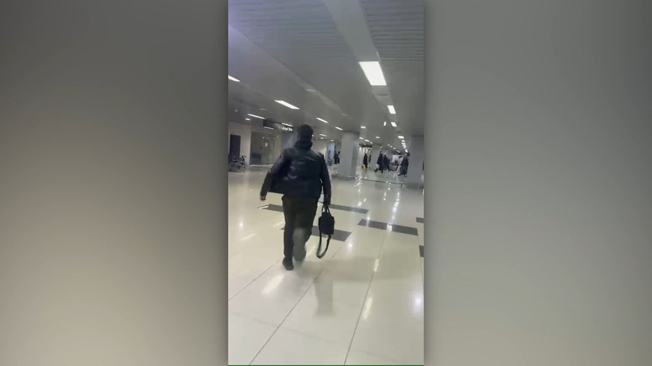 <p>Video shows scenes of chaos at Damascus airport as people attempt to flee rebel advance</p>