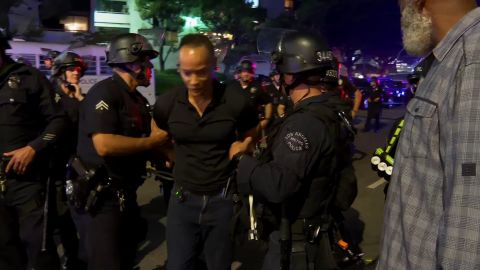 <p>CNN's Jason Carroll escorted out of LA protest zone by police officers.</p>