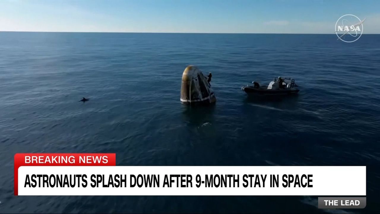 Dolphins greet astronauts as SpaceX capsule splashes down | CNN