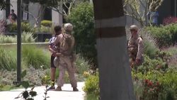 <p>Video shows a marine detaining a man while standing guard at a federal building in Los Angeles, CA. CNN has reached out to the U.S. Marine Corps for more information. </p>