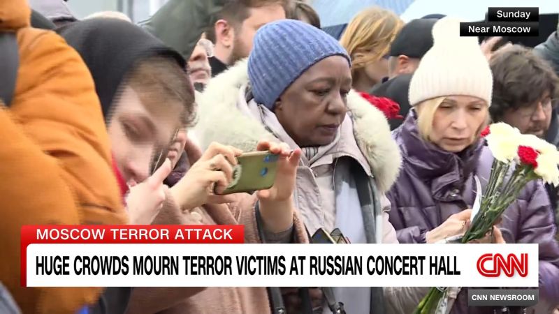 CNN's Matthew Chance speaks with people at the makeshift memorial outside the Crocus Concert Hall in Moscow, where more than 130 people were killed in a terror attack.