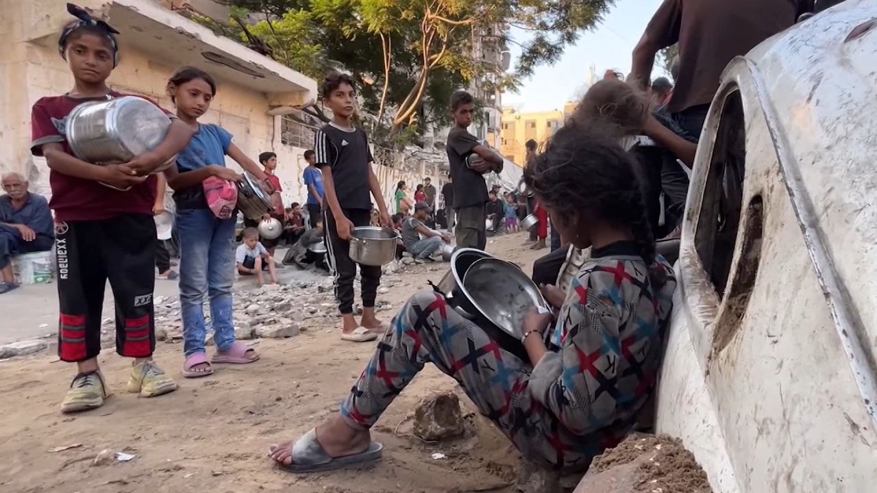People fight for scraps of food in Gaza