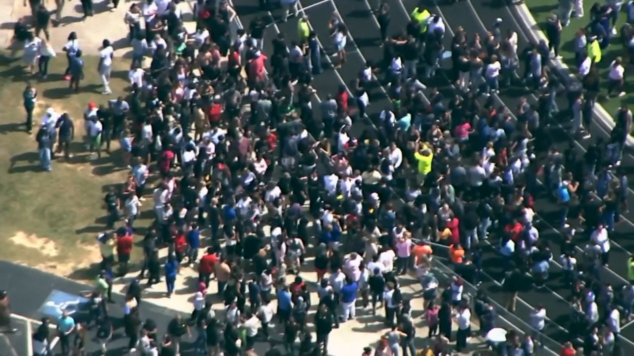 <p>Parents wait to reunite with their children outside of Apalachee High School in Winder, Georgia, after at least four people were killed in a shooting, according to law enforcement sources out of the state. </p>