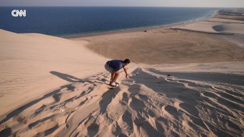 <p>CNN's Bijan Hosseini tries sandboarding down Qatar’s desert dunes, and takes in the scenery of the breathtaking UNESCO-recognized inland sea.</p>