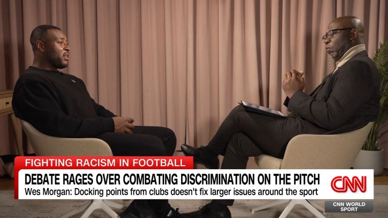 <p>Leicester City's iconic Premier League winning captain Wes Morgan believes that clubs should not be docked points if their fans are found to have committed racist abuse. Morgan, who is part of the league's Black Participants Advisory Group, was speaking to CNN's Senior Sports Analyst Darren Lewis when he said it would be more beneficial to identify those guilty of racist and discriminatory behavior and to "prosecute" the individuals concerned or give them "stadium bans" rather than penalizing clubs. Morgan did admit that more needed to be done to diversify management roles and boardroom positions in the league, but said he was pleased to see the Premier League launch a few programmes to address these issues.  </p>